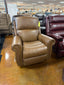 Dutton Recliner 828-10-LB2137-77 tan leather rocking recliner with brass nailhead trim on the rolled arms.
