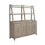The Liberty Furniture Brentwood Sideboard 789-SB6836-SH6838 is a light wood piece featuring four cabinet doors with vertical metal handles and an open, three-tiered shelving unit on top.