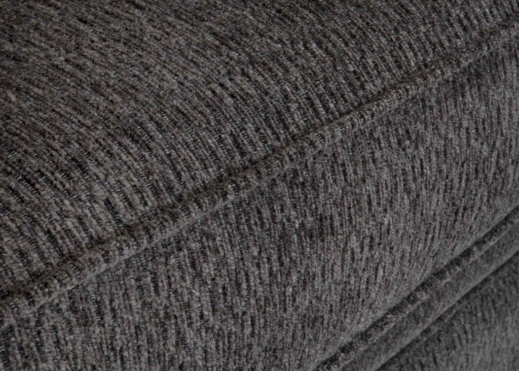Close-up of the textured charcoal gray fabric upholstery, highlighting the meticulous stitching and surface details of a cushion from the Fairmont Shasta Charcoal Sectional (256-28-49-3403-05) by Franklin Furniture Corp.