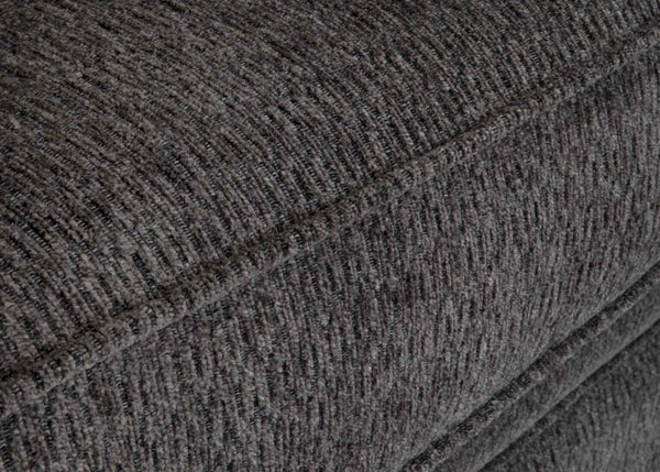 Close-up of the textured charcoal gray fabric upholstery, highlighting the meticulous stitching and surface details of a cushion from the Fairmont Shasta Charcoal Sectional (256-28-49-3403-05) by Franklin Furniture Corp.