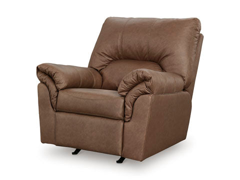 The WillowBend Caramel Recliner 2770425 by Ashley is a large, plush rocker recliner featuring padded armrests and backrest, upholstered in supple faux leather and shown against a white background.