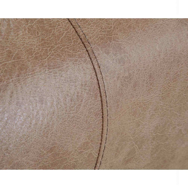 Close-up of a textured light brown leather surface with visible stitching and natural creases, highlighting the premium craftsmanship of the Trilogy Marshall Camel Recliner 4595-8621-25 by Franklin Furniture Corp. This manual recliner features a WOW Seating System for enhanced comfort.