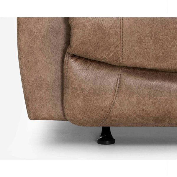Close-up of the bottom corner of the Trilogy Marshall Camel Recliner 4595-8621-25 by Franklin Furniture Corp., featuring the WOW Seating System—highlighting the rich camel brown upholstery texture and a small black sofa leg against a white background.