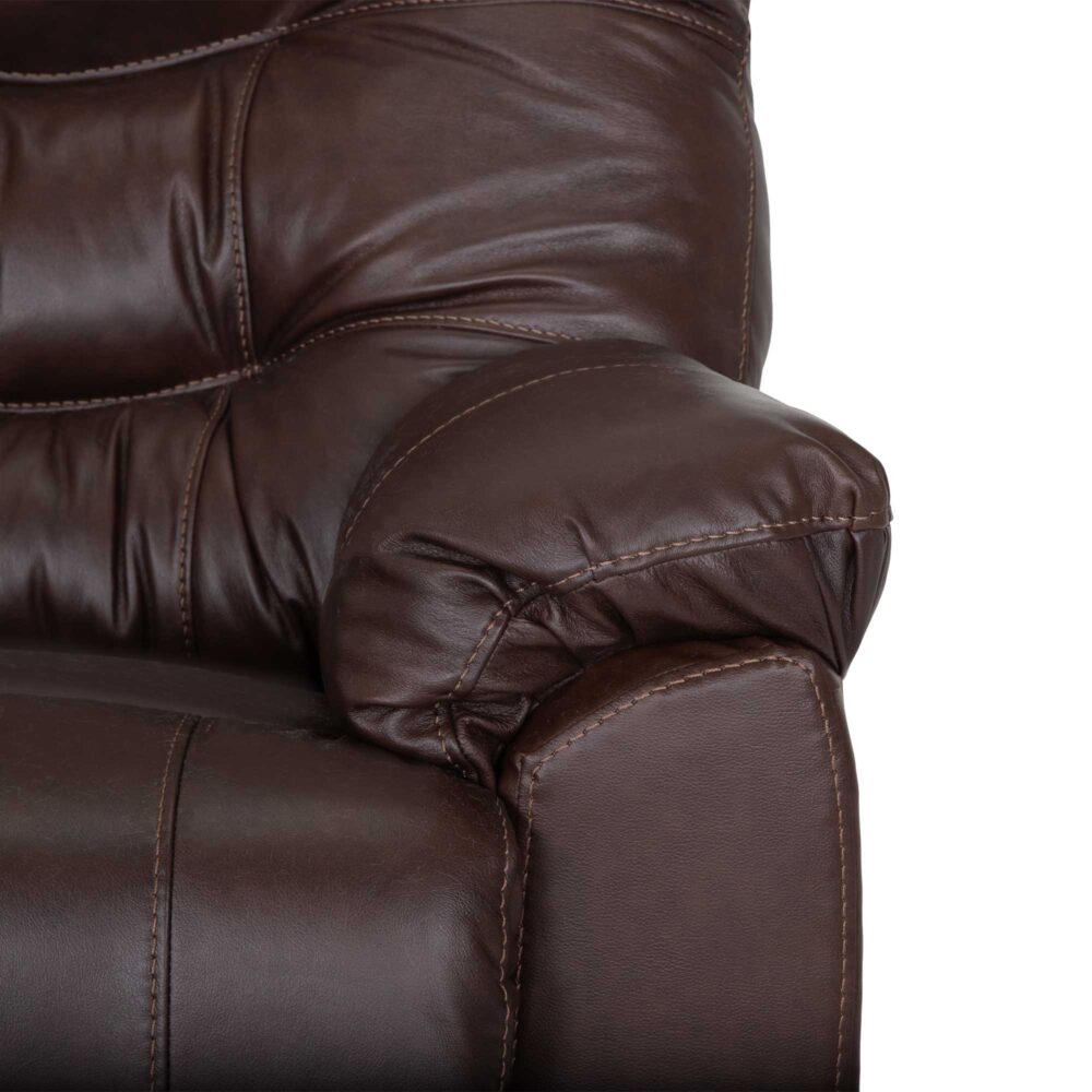 Close-up of the Trilogy Frederica Brown Recliner 4595-LM98-15 by Franklin Furniture Corp., highlighting the armrest and portions of the seat and backrest with visible stitching, padded and tufted leather upholstery, and supportive gel-blended cushions.