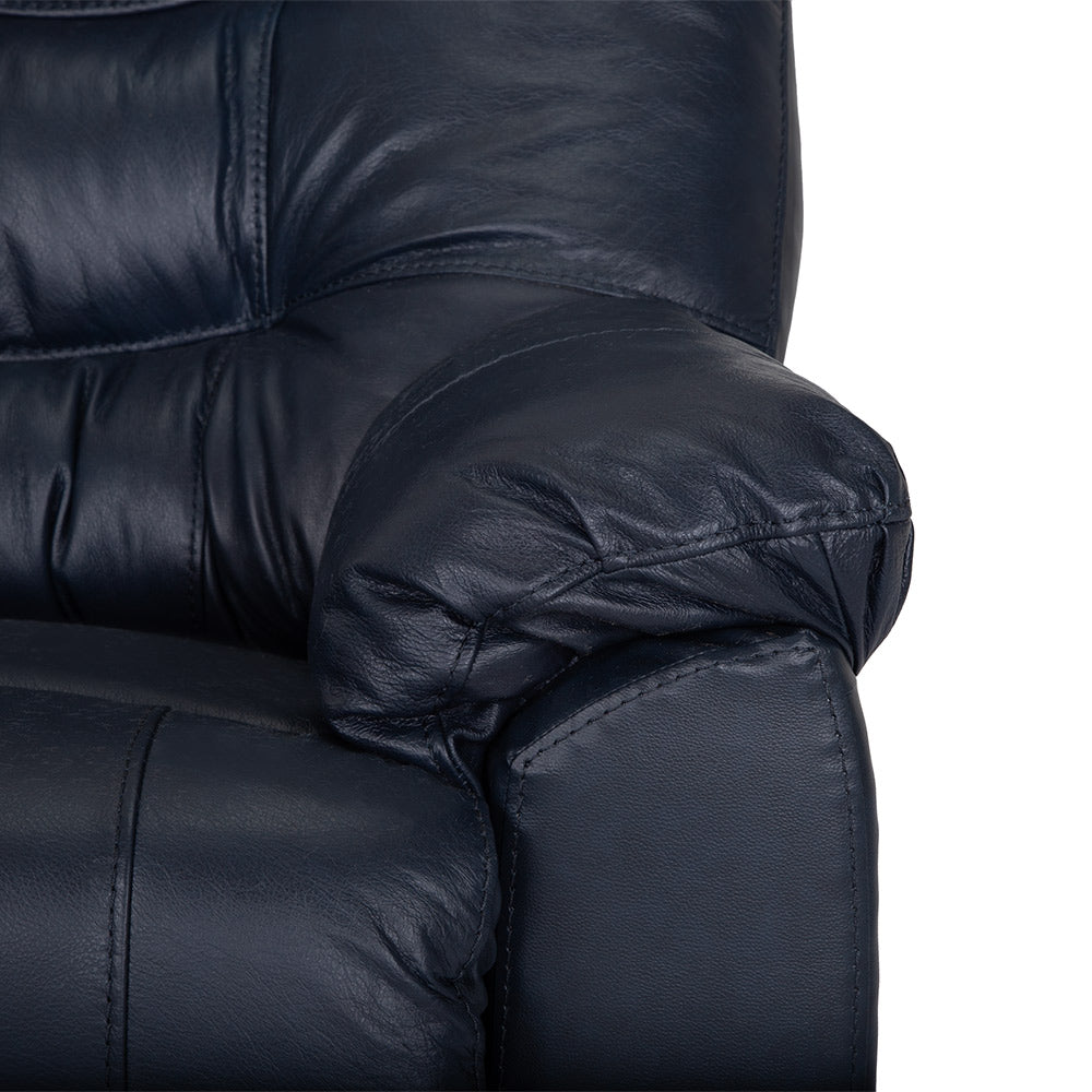 Close-up of the armrest and part of the backrest of a Franklin Furniture Corp. Trilogy Frederica Navy Recliner 4595-LM98-43, showcasing visible stitching and a plush, padded surface for enhanced comfort.