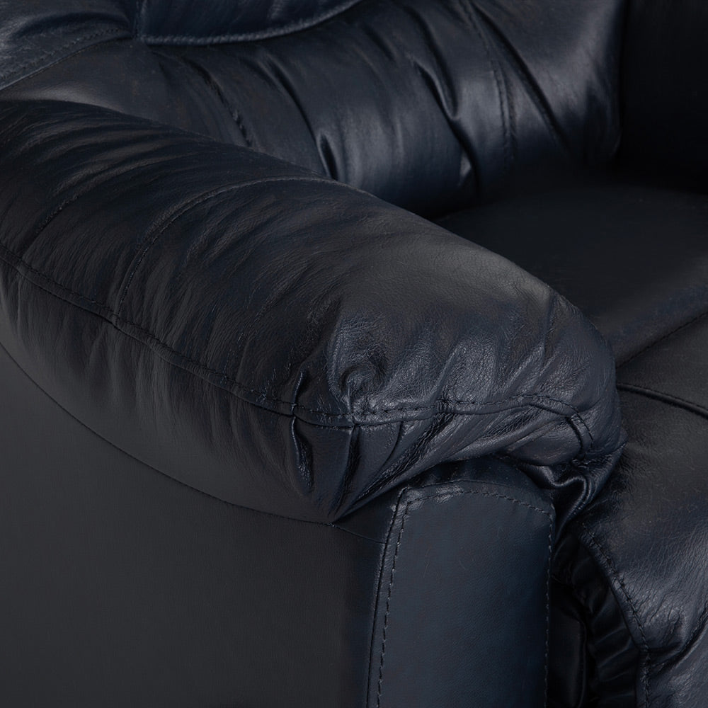 Close-up of the Trilogy Frederica Navy Recliner 4595-LM98-43 by Franklin Furniture Corp., highlighting its padded armrest and seat with visible creases and stitching details. The recliner features gel-blended cushions for enhanced comfort.