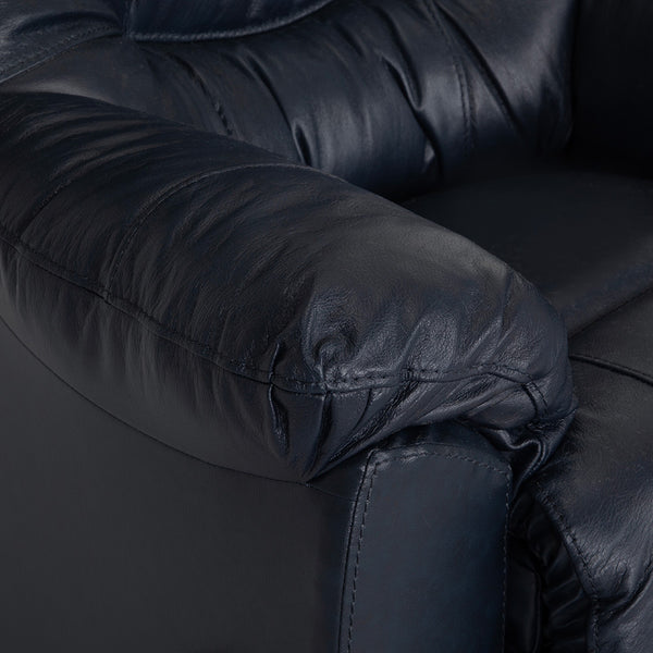 Close-up of the Trilogy Frederica Navy Recliner 4595-LM98-43 by Franklin Furniture Corp., highlighting its padded armrest and seat with visible creases and stitching details. The recliner features gel-blended cushions for enhanced comfort.