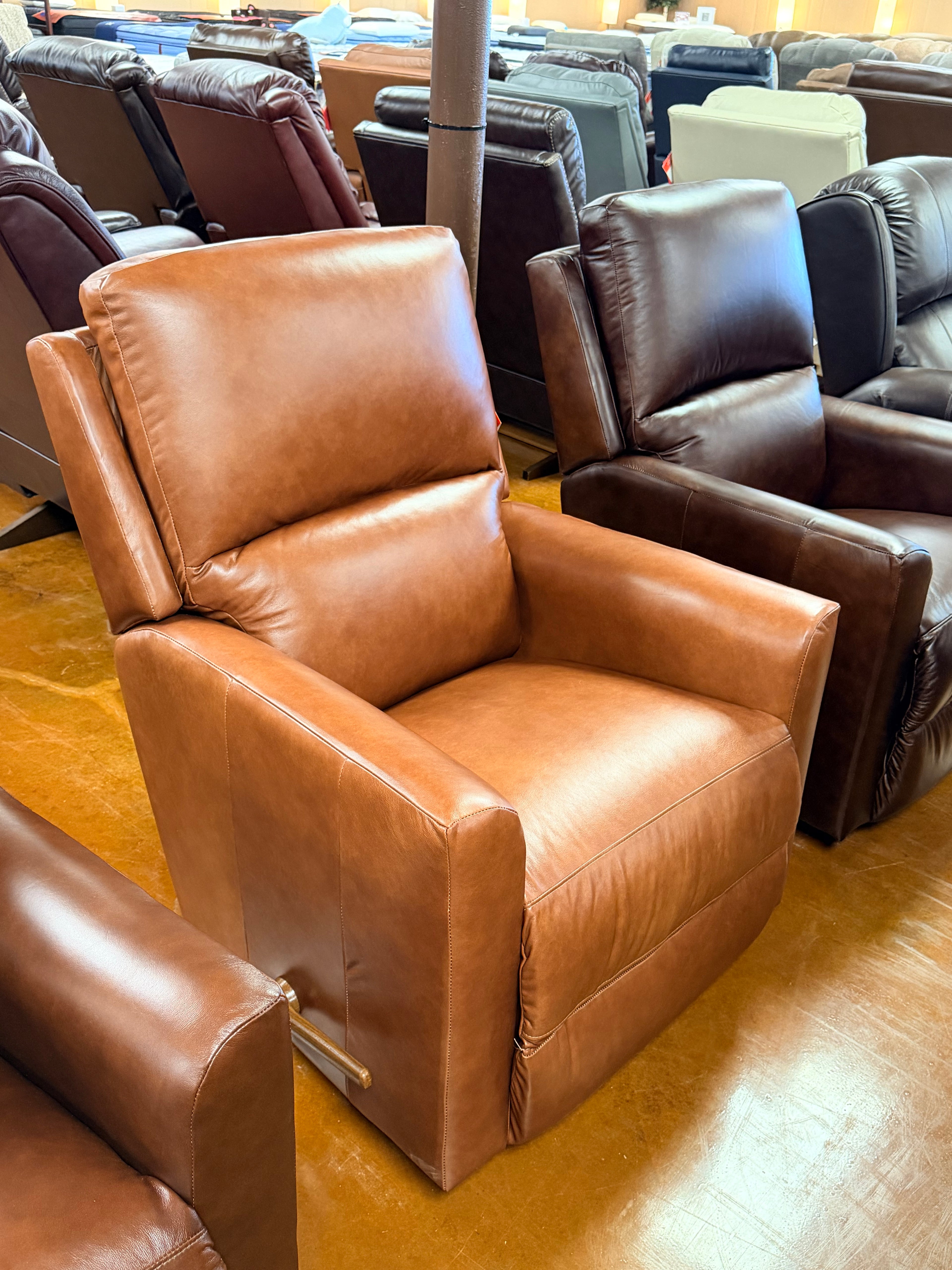 Brown leather sofa in a showroom setting