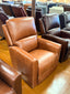 Brown leather sofa in a showroom setting