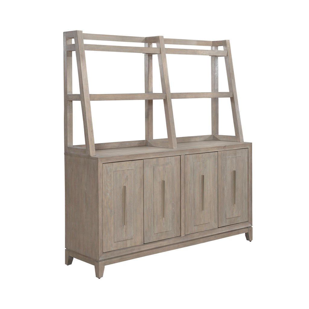 The Liberty Furniture Brentwood Sideboard 789-SB6836-SH6838 is a light wood piece featuring four cabinet doors with vertical metal handles and an open, three-tiered shelving unit on top.