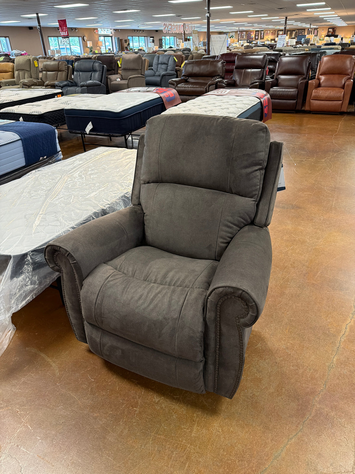 A dark gray La-Z-Boy Dutton Recliner 828-10-D2128-56 rocking recliner with nailhead trim on the arms. Main image