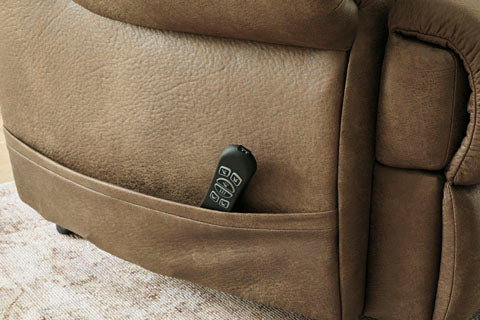 Brown faux leather Revived and Restored Earth Lift Chair 8240712 power lift recliner with a remote control tucked into a side pocket.