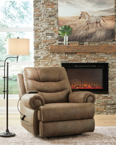 Ashley Revived and Restored Earth Lift Chair 8240712, a brown faux leather power lift recliner with a remote control, positioned in a living room near a fireplace.