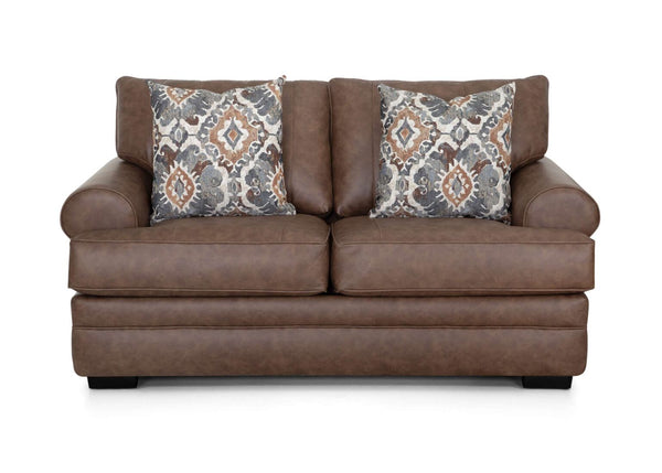 The Langston Duvall Vintage Brown Loveseat 83220-3429-16 by Franklin Furniture Corp. features wide padded arms, two seat cushions, and two patterned throw pillows in shades of gray, brown, and orange. Set against a white background, this inviting loveseat from the Langston Collection is designed with the WOW Seating System for superior comfort.