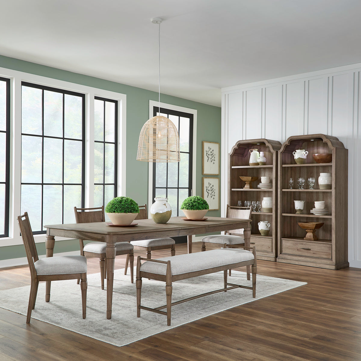 Liberty Furniture Hickory Grove Table and 4 Chairs and Bench 866-C9001B-C9101S-T4292 featuring a rectangular wood table, four upholstered chairs, and a bench, arranged in a dining room with two tall wooden display cabinets.