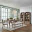 Liberty Furniture Hickory Grove Table and 4 Chairs and Bench 866-C9001B-C9101S-T4292 featuring a rectangular wood table, four upholstered chairs, and a bench, arranged in a dining room with two tall wooden display cabinets.