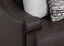Close-up of the Prescott Duvall Coffee Loveseat by Franklin Furniture Corp., upholstered in rich dark brown leather reminiscent of premium chocolate, with beige textured and patterned decorative pillows arranged along the backrest.