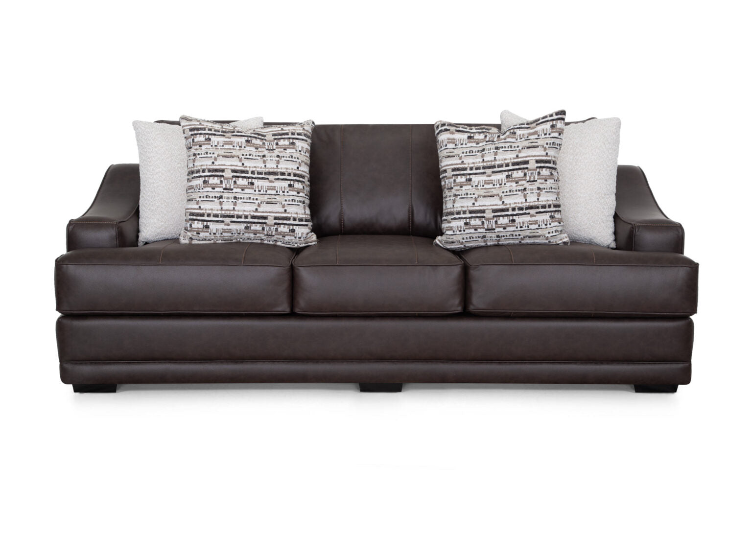 A Prescott Duvall Coffee Sofa (model 89340-3429-10) by Franklin Furniture Corp., upholstered in dark brown with three seat cushions and four decorative throw pillows—two with geometric patterns and two in a light solid color—is displayed against a white background, highlighting the comfort of its WOW Seating System.