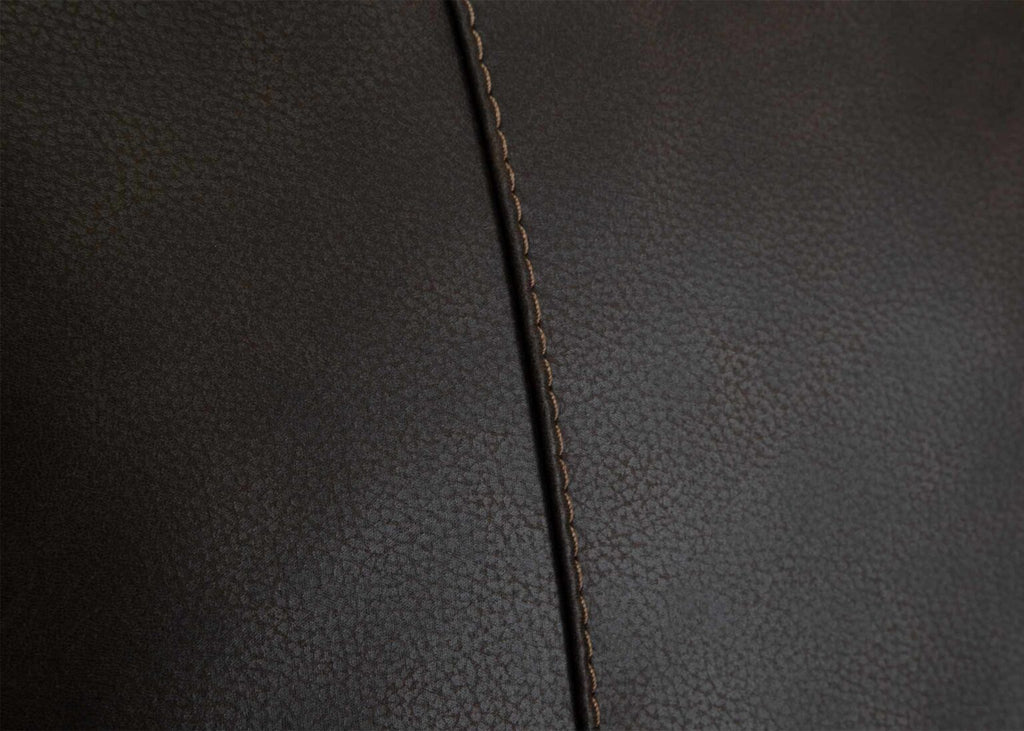 Close-up of rich dark brown leather with a prominent vertical seam, highlighting the texture and stitching detail on the Prescott Duvall Coffee Sofa 89340-3429-10 by Franklin Furniture Corp.