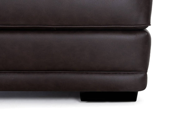 Close-up of the bottom corner of the Franklin Furniture Corp. Prescott Duvall Coffee Sofa 89340-3429-10 with a visible leg, highlighting the luxurious chocolate fabric upholstery and WOW Seating System, set against a white background.
