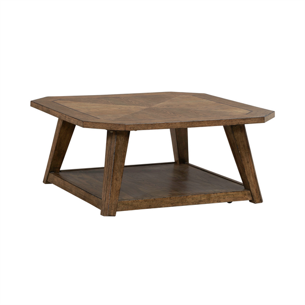 The Carolina Park Cocktail Table 930-OT1010 by Liberty Furniture showcases a square wood veneer design with angled legs and a lower shelf, highlighted by its natural brown finish and geometric pattern on the tabletop. Blending timeless style with modern flair, this coffee table makes an ideal accent for any living space.
