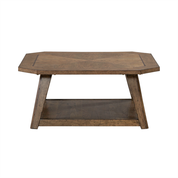 The Liberty Furniture Carolina Park Cocktail Table (930-OT1010) features a wood veneer octagonal top, angled legs, and a lower shelf—an elegant design showcased against a white background.