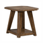 The Carolina Park End Table 930-OT1021 by Liberty Furniture features a hexagonal top, angled legs, and a lower shelf. Crafted with white oak veneers in a medium brown finish that highlights the natural wood grain for a rustic look, this table is displayed against a plain white background.