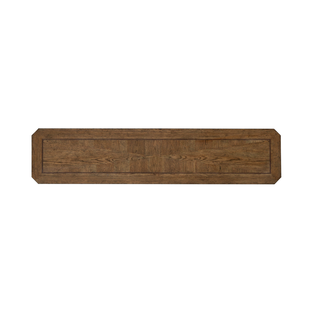 A long, rectangular wooden panel with beveled edges and a visible wood grain pattern, crafted from white oak veneers in an Amber Brown finish by Liberty Furniture. The corners are cut at an angle, giving the piece an octagonal appearance at each end—reminiscent of the refined style of the Carolina Park Sofa Table 930-OT1030.