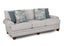 The Annisa Julien Cork Sofa 95740-3574-20 by Franklin Furniture Corp. is shown in light gray upholstery, featuring three reversible seat cushions and four decorative pillows—two with blue patterns and two in solid blue—set against a white background. The sofa includes the WOW Seating System, wooden legs, and slightly rolled arms.