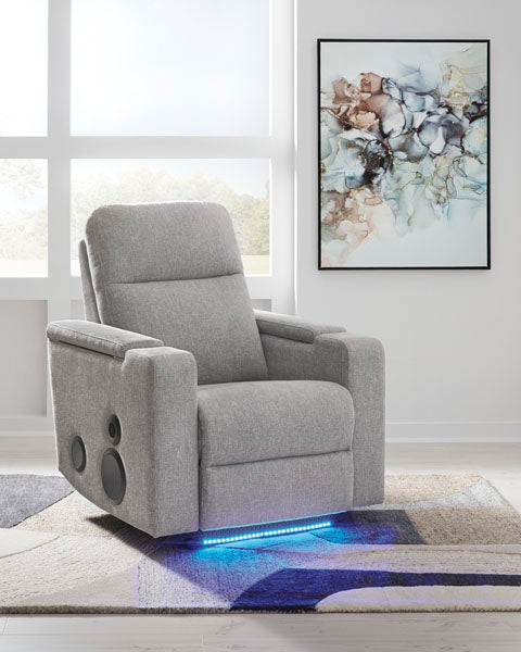 Light gray Pineland Pewter Power Recliner 9930642A upholstered power recliner with integrated audio system speakers and blue LED base lighting.