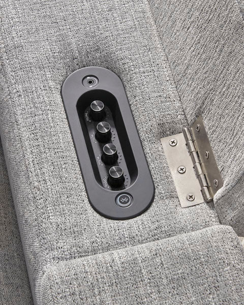 Control panel with four circular buttons and a power icon embedded in the armrest of a grey fabric Pineland Pewter Power Recliner 9930642A.
