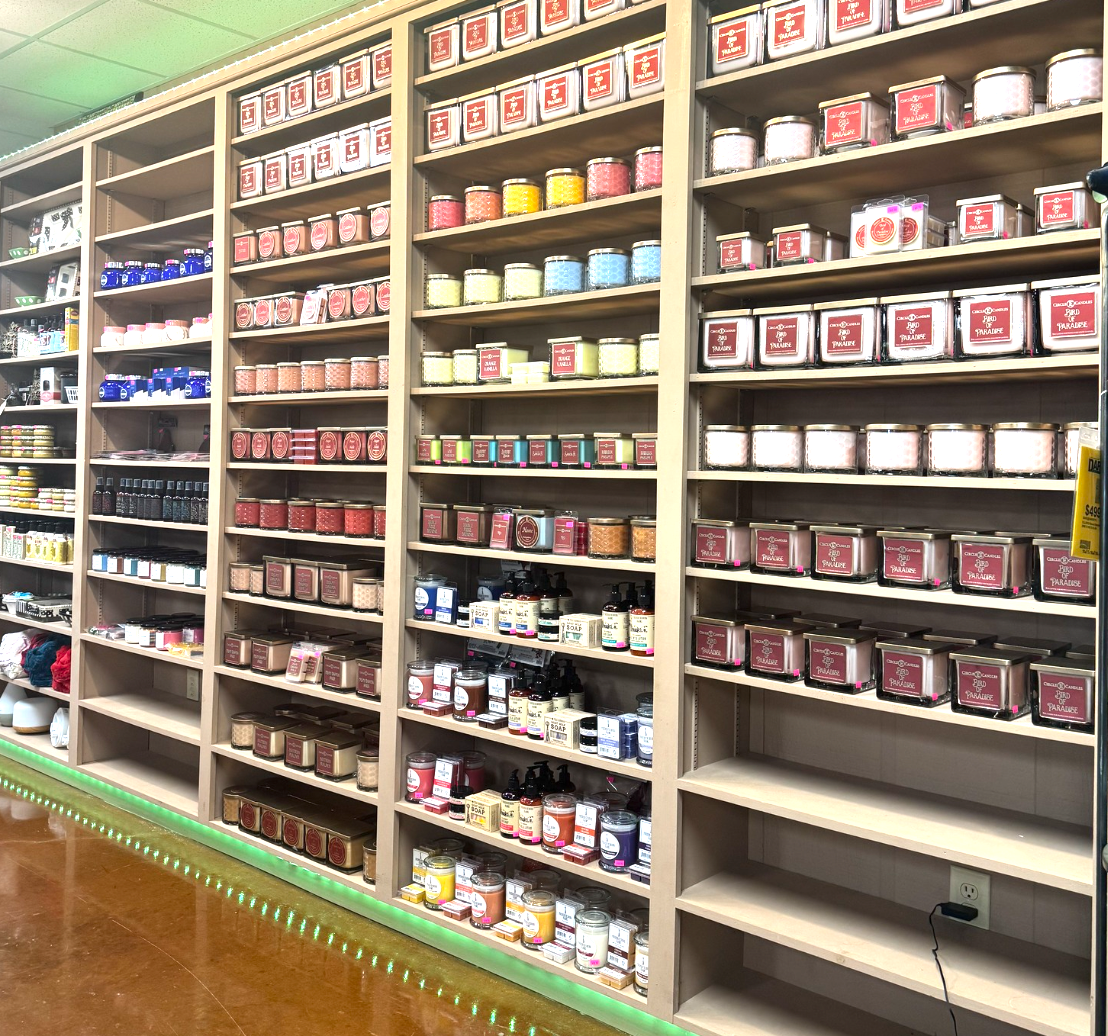 Shelves stocked with various products in a store setting