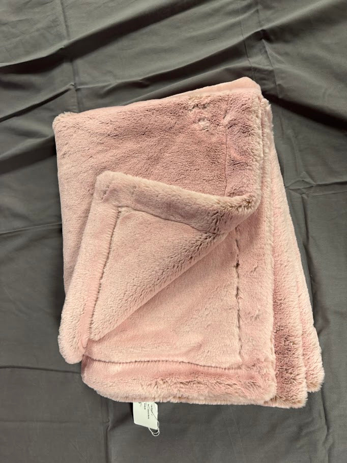 Pink plush blanket on a gray surface Main image