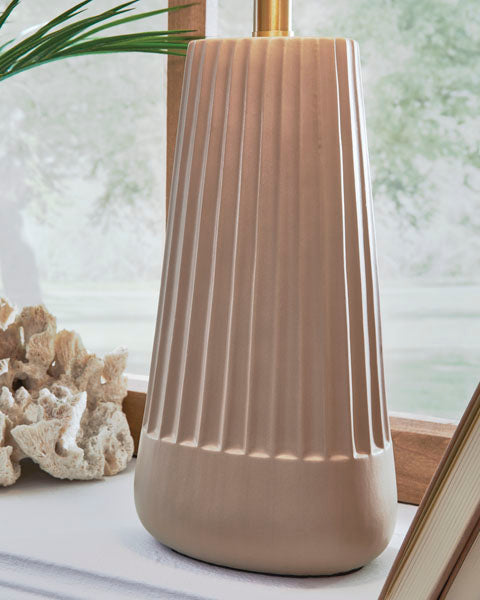 A tan Dellner Lamp L100854 with a tapered, rounded base featuring vertical reeding.