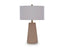 Ashley Dellner Lamp L100854 contemporary table lamp with a drum shade and a tapered, vertically reeded base.