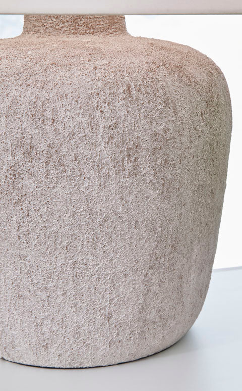 Danry Lamp L207454 table lamp with a distressed cream, textured base and a drum shade, offering a casual style.