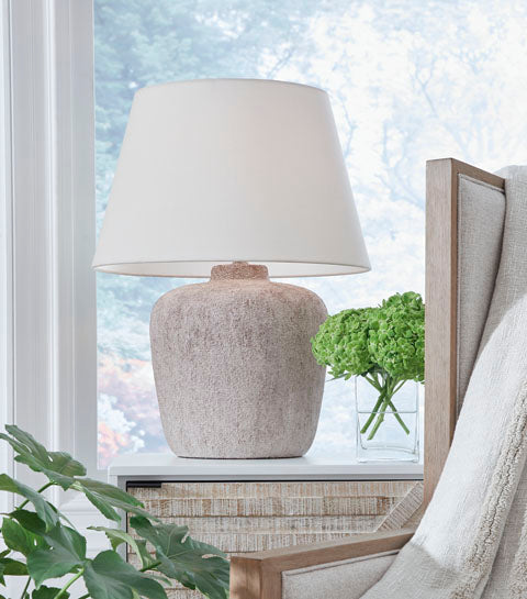 Danry Lamp L207454 table lamp with a tapered white shade and a distressed cream base in a casual style.
