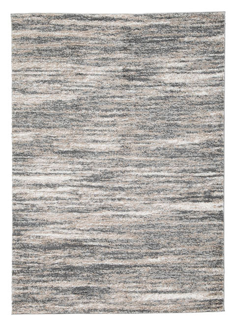 The Gizela Rug R404861 by Ashley is a rectangular area rug featuring a textured, abstract pattern in shades of gray, white, and beige. Its plush pile offers extra comfort underfoot, while the colors create a subtle, wavy striped effect across the surface.