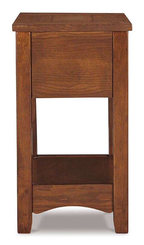 Breegin Brown Chairside End Table T007-319, a tall, brown Mission-style chairside end table featuring a small upper drawer and an open lower shelf.