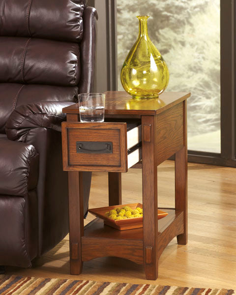 Breegin Brown Chairside End Table T007-319 in brown wood with an open drawer containing a glass of water, a yellow glass vase on top, and a square dish with decorative spheres on the lower shelf.