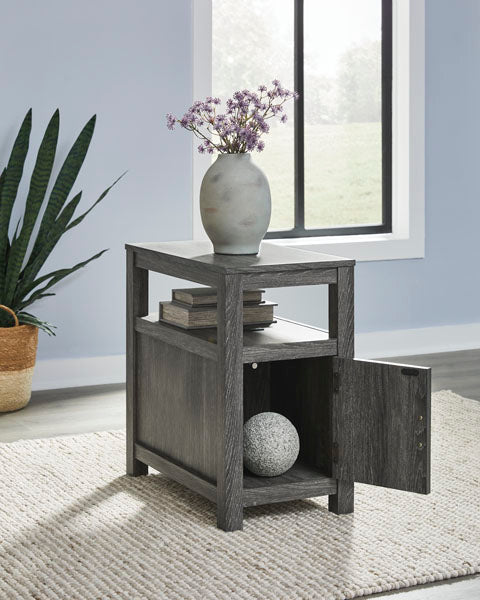 Fendenmore Gray Chairside End Table T190-317 featuring a weathered gray finish, an open middle shelf, and a storage cabinet with an open door.