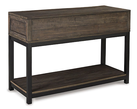 The Ashley Johurst Sofa Table (T444-4) features a rectangular wooden design with a dark wood top and shelf, supported by a black metal frame. Perfect as a sofa table, its simple modern-industrial style effortlessly complements any modern farmhouse or rustic retreat décor.