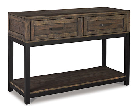 The Ashley Johurst Sofa Table T444-4 features a wooden construction with two drawers, a lower shelf, and black metal legs; this modern farmhouse piece is displayed at an angle on a white background. Main image