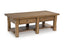 The Ashley Vandenmore Coffee Table (T539-1) is a rectangular farmhouse-style piece featuring two drawers with metal knobs, a lower shelf for storage, sturdy legs, and a natural wood finish.