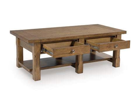 The Ashley Vandenmore Coffee Table T539-1 features a rectangular wooden design with two open drawers and a lower shelf for extra storage, shown against a white background. This charming piece adds farmhouse style to any living space.