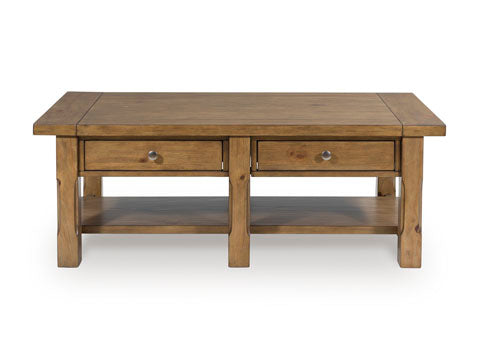 The Ashley Vandenmore Coffee Table T539-1 is a farmhouse-inspired rectangular wooden table featuring a natural finish, two drawers with metal knobs, a lower shelf, and ample storage for your living room essentials.
