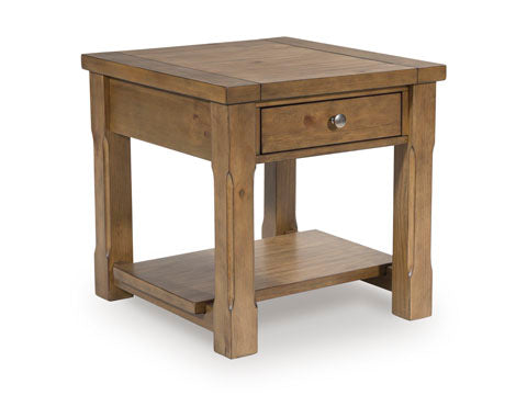 The Ashley Vandenmore End Table T539-3 showcases a farmhouse-inspired design with a square silhouette, one drawer featuring a round metal knob, sturdy legs, and a lower shelf for added sofa-side storage. Finished in a light brown wood tone.