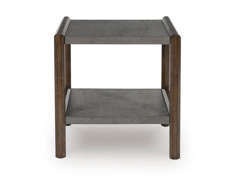 The Ashley Kallenny End Table T669-3 features a modern, square silhouette with a gray top and open lower shelf, supported by four wooden legs. Showcasing a mixed-material design for a minimalist, industrial-inspired look, this end table offers extra storage or display space while adding contemporary style to any room.