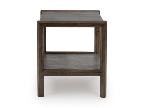 The Ashley Kallenny End Table (T669-3) is a square wooden table with a dark finish, featuring an open lower shelf and simple, straight legs. Its minimalist, modern design is complemented by a subtle industrial edge.