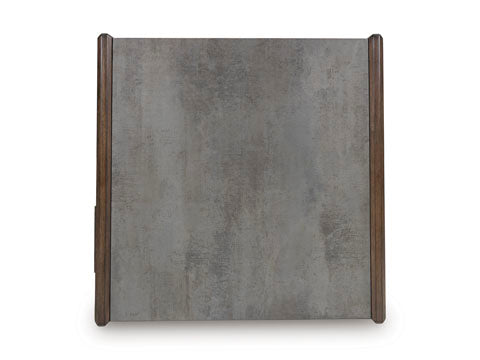 The Ashley Kallenny Cocktail Table T669-8 features a square, gray textured surface highlighted by two vertical dark wooden edges on each side, adding an industrial edge to any space—shown from above against a white background.